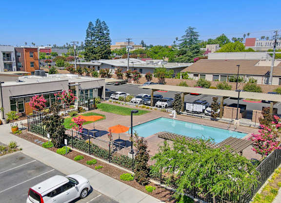 Poolside amenity area with recreational facilities at Anton Arcade Apartments, California, 95825