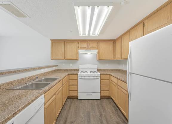 Kitchen with wooden cabinetry at Creekside at Meadow Park, Novato, California