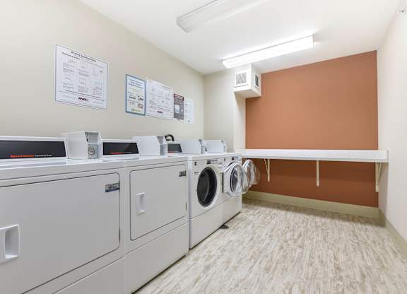 A row of washing machines in a laundromat.