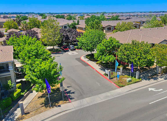 A residential area with houses and a road at Hurley Creek Apartment Homes, Sacramento, California
