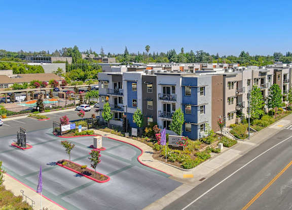 Modern apartment buildings with street view at Anton Arcade Apartments, Sacramento, CA 95825