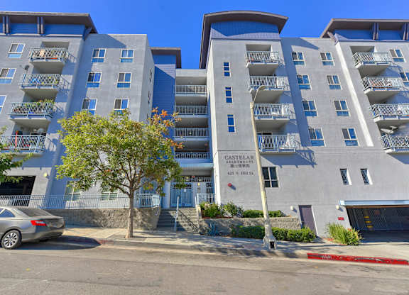 A modern apartment building with a sign that reads "Castella".