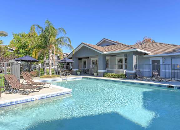 A house with a pool in the backyard.