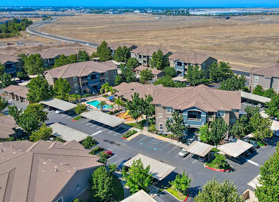 A bird's eye view of a residential area with houses and trees.