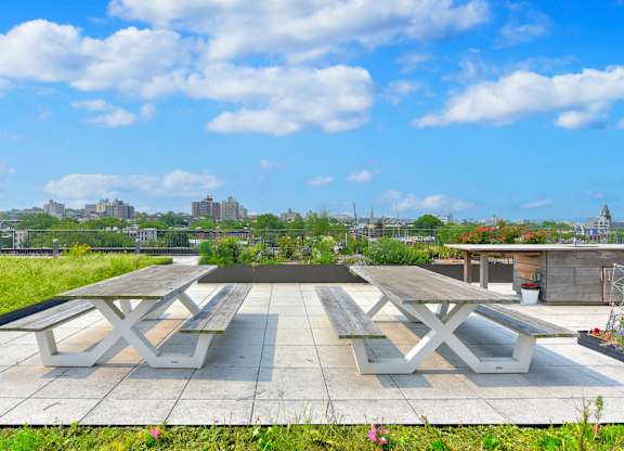 Rooftop Terrace Area with picnic tables at 535 Carlton Ave Apartments, Brooklyn, NY, 11238