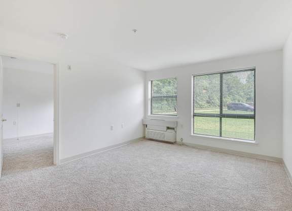 Large empty room at Cascades Village (55+) Apartments, Sterling, VA