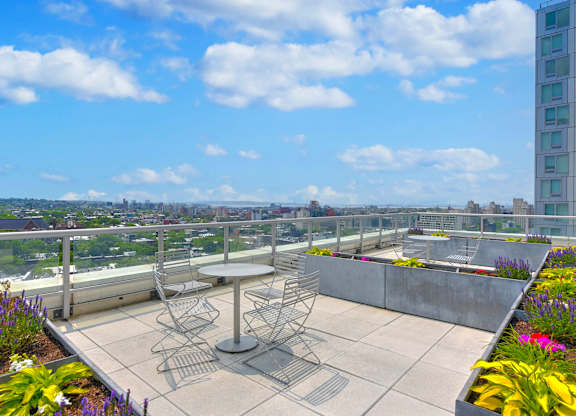 Rooftop Patio with Overlooking a City Skyline at 38 6th Ave Apartments, Brooklyn, New York