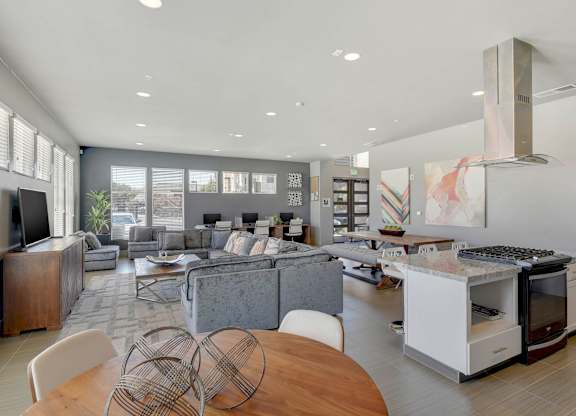 Open concept living space with modern kitchen island at Anton Arcade Apartments, Sacramento, California