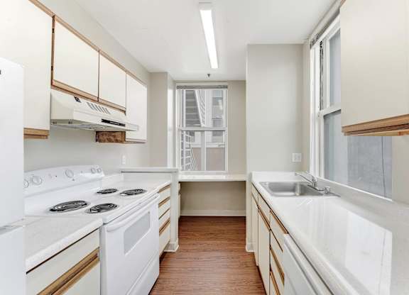 Kitchen with White Appliances at Vintage Tower Apartments, California