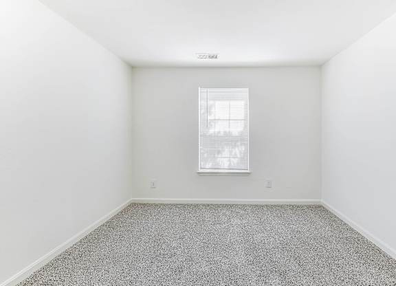 A room with a window and carpeted floor at Acclaim at Sterling in Sterling, 20164