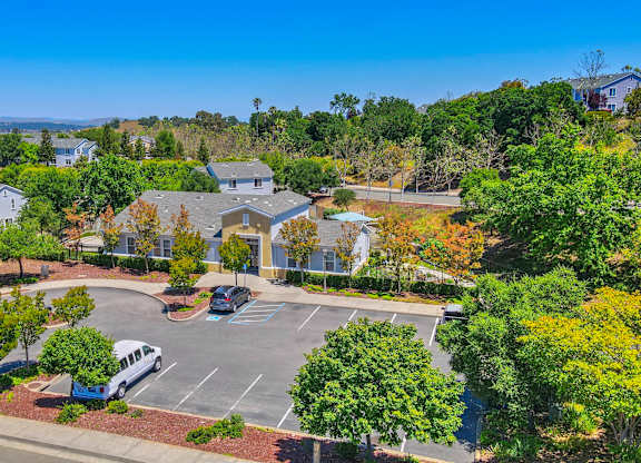 Parking lot with cars at Creekside at Meadow Park, California, 94949
