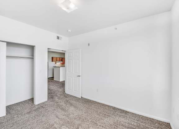 A room with white walls and a carpeted floor.at Sable Ridge Senior Residences South, Colorado, 80239