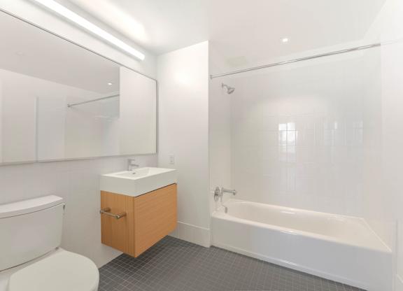 White Bathroom with a Toilet at 535 Carlton Ave Apartments, Brooklyn, 11238