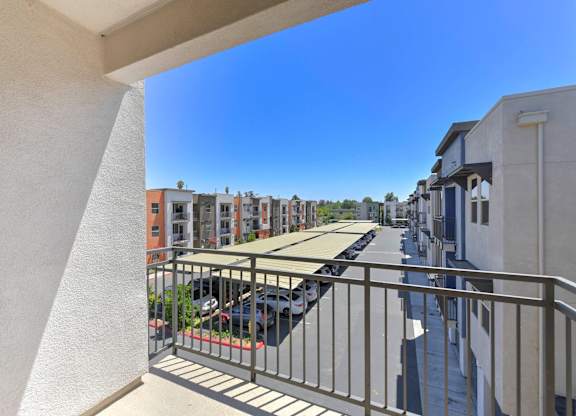 Balcony view overlooking parking area and buildings at Anton Arcade Apartments, California, 95825