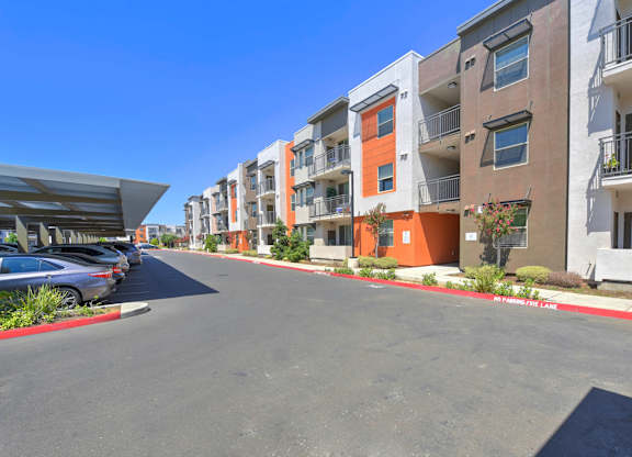 Modern apartment buildings with covered parking at Anton Arcade Apartments, Sacramento, 95825