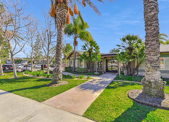 A residential area with a house, trees, and a concrete path at Yorba Linda Apartments, Yorba Linda, CA 92886