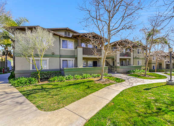 Apartment complex with a green lawn and trees at Yorba Linda Apartments, Yorba Linda, 92886