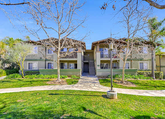 Apartment complex with a green lawn in front at Yorba Linda Apartments, California, 92886