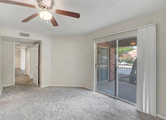 Living Area With Ceiling Fan at Cooper's Crossing, Irving, 75038