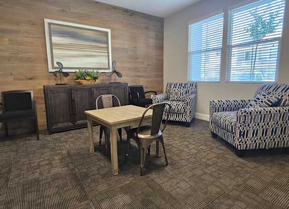A room with a wooden wall and a painting on it.