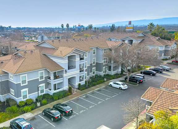 Aerial view of residential buildings with parking at Lincoln Creek Apartments, Dixon, CA 95620