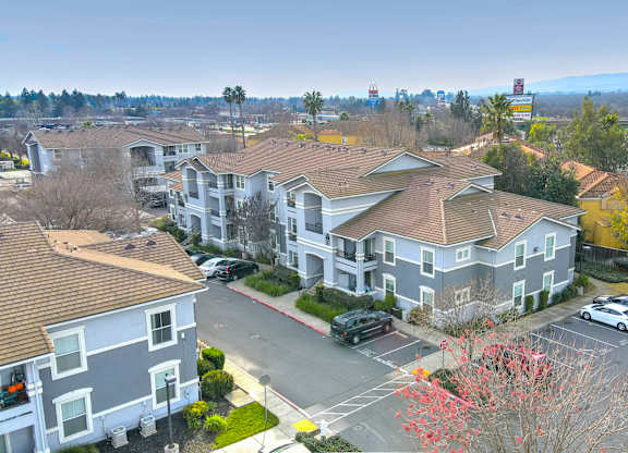 Aerial view of apartment buildings with parking areas at Lincoln Creek Apartments, Dixon, CA