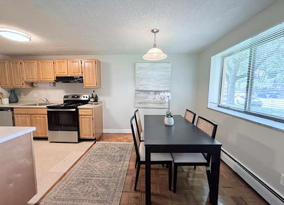 Kitchen and Dining Table at Morton Village Apartments, Mattapan