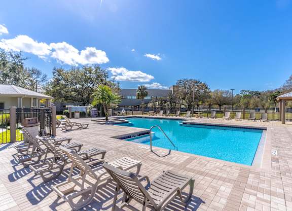 Pool With Lounge Chairs at Retreat at Valencia Apartment Homes, Orlando Florida