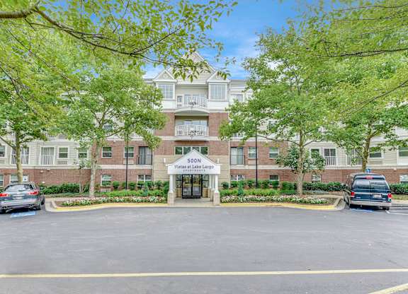 Parking area in front of the building at Vistas at Lake Largo 55+ Senior Community, Largo, Maryland