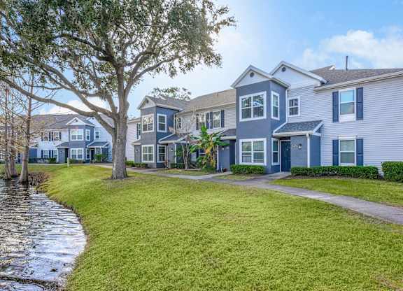 Beautiful Garden Exterior at Wellington Woods Apartments, Kissimmee, FL