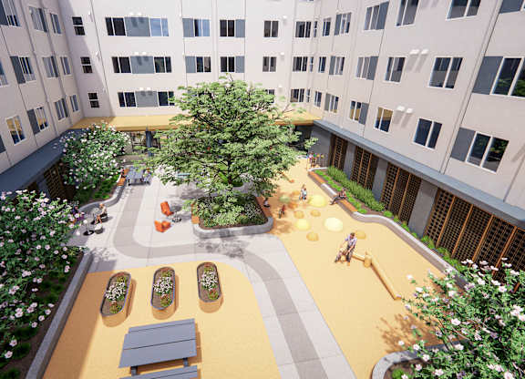 A courtyard with a tree, benches, and a playground at Rivo Apartments, Sacramento, 95815
