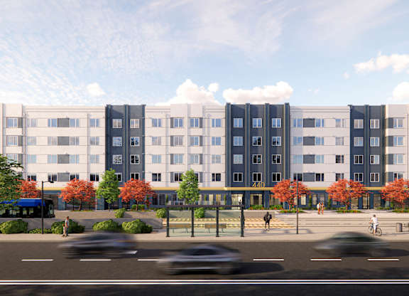 A large building with a lot of windows and a few trees in front of it at Rivo Apartments, Sacramento, California