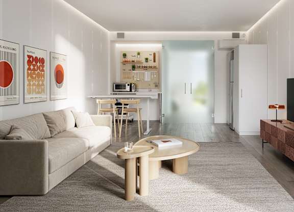 A modern living room with a grey sofa, wooden coffee table, and a flat screen TV.