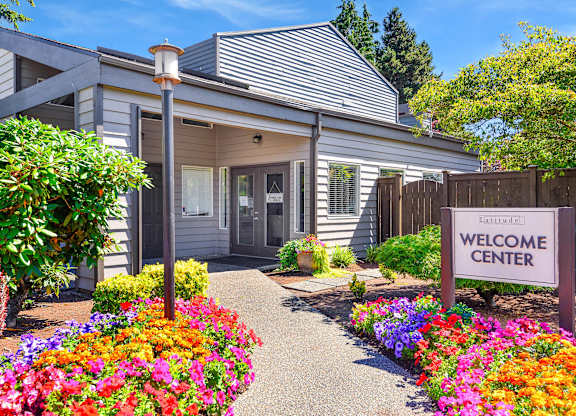 A building with a sign that says Welcome Center.