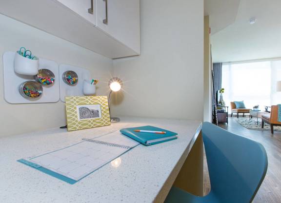 A white desk with a notebook and a planner on it at View Point Apartments, Berkeley, 94710
