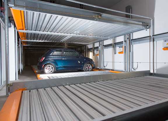 A blue car is parked in a car wash at View Point Apartments, Berkeley, 94710