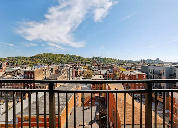 A cityscape viewed from a balcony.