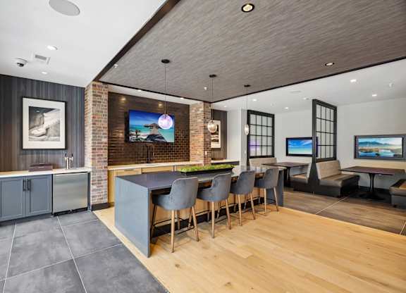 A modern living room with a brick wall and a television.
