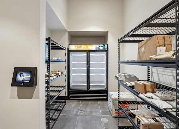 A storage room with shelves and boxes on them.
