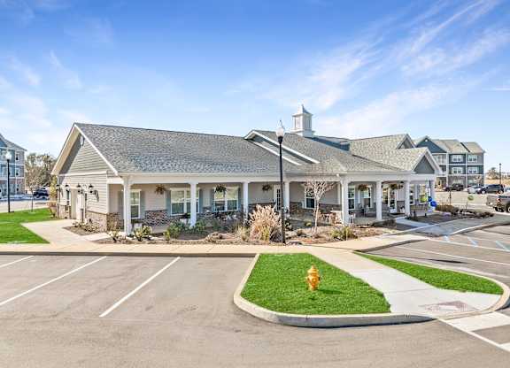 A building with a parking lot in front of it.