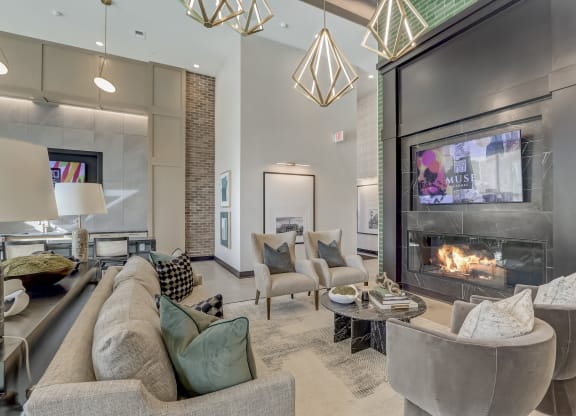 a living room with a fireplace and couches