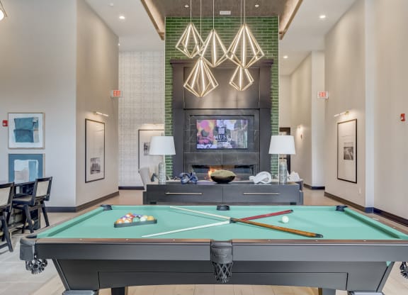 play a game of pool in our clubhouse at our apartments