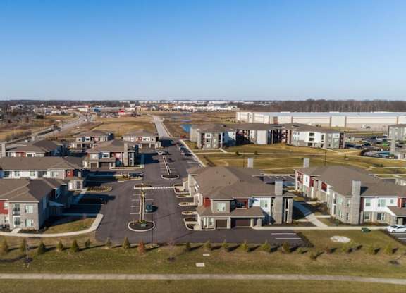 an aerial view of a neighborhood with houses and a road at Echo Park at Perry Crossing Apartments, Plainfield, 46168