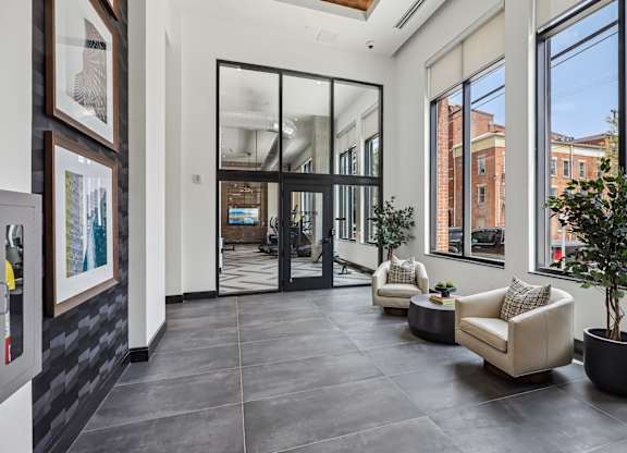 A modern living room with a black and white color scheme.