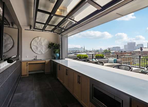 A kitchen with a view of the city.