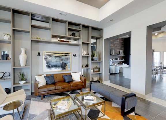a living room with a couch and a table at Echo Park at Perry Crossing Apartments, Indiana