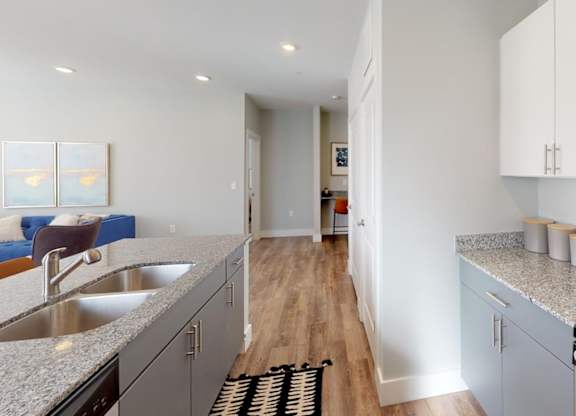 a modern kitchen with granite counter tops and stainless steel appliances at Echo Park at Perry Crossing Apartments, Plainfield, 46168