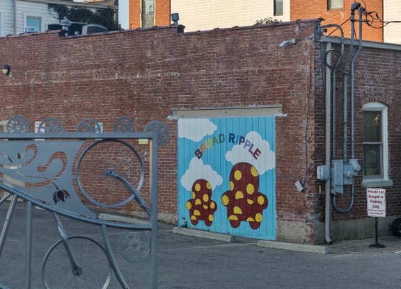 a mural on the side of a brick building