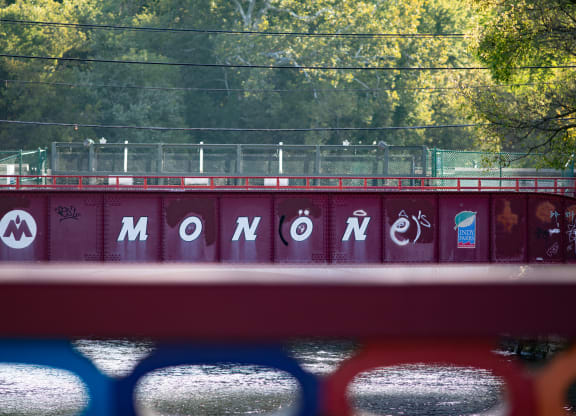 a train bridge with the word momomo written on it