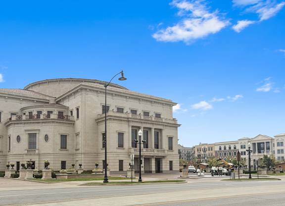 a large white building on the corner of a street